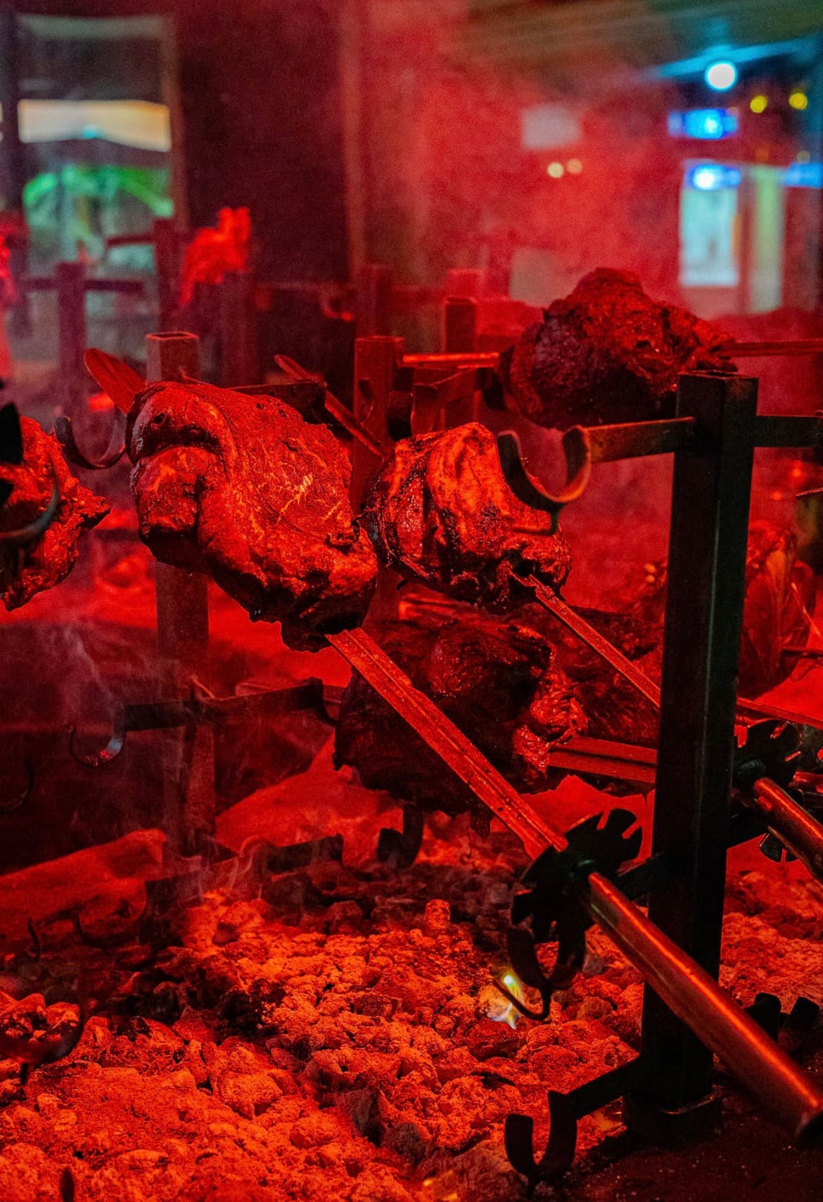 Meats at the Carnivore Restaurant Nairobi roasted over hot coals on traditional Maasai swords